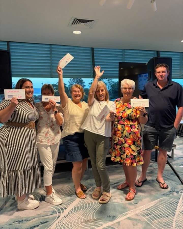 Happy Family raising their brochures